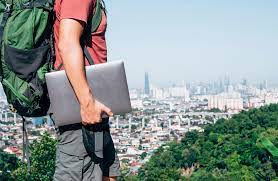 man holding a laptop